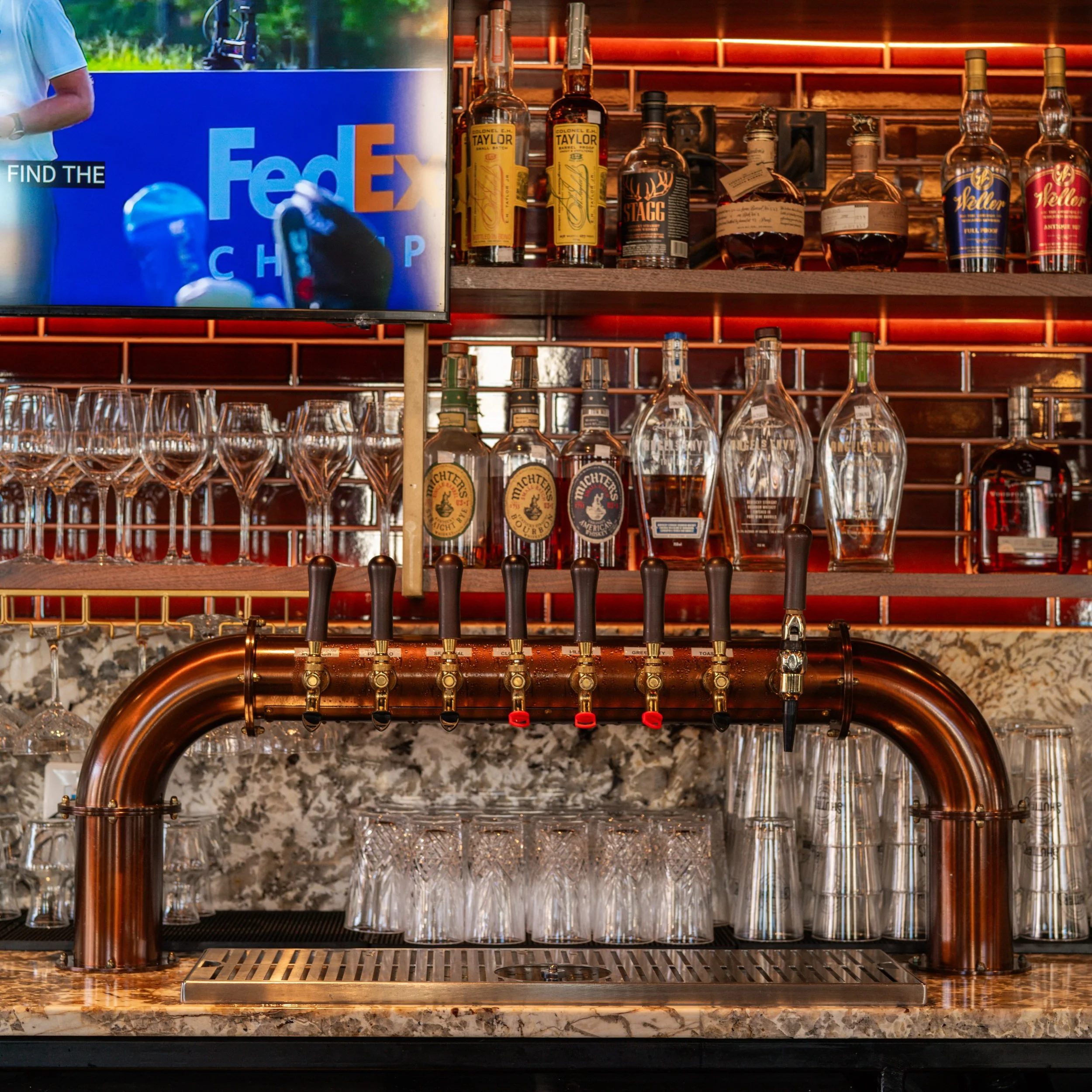 Designed for the experience, down to the last detail.

Historic architecture meets a darker, more refined hospitality palette. Original brick, rich wood tones, custom millwork, patterned tile and layers of warm lighting.

A space that feels establish