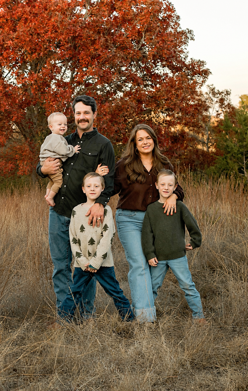 The Pieper family outdoors with their three sons.