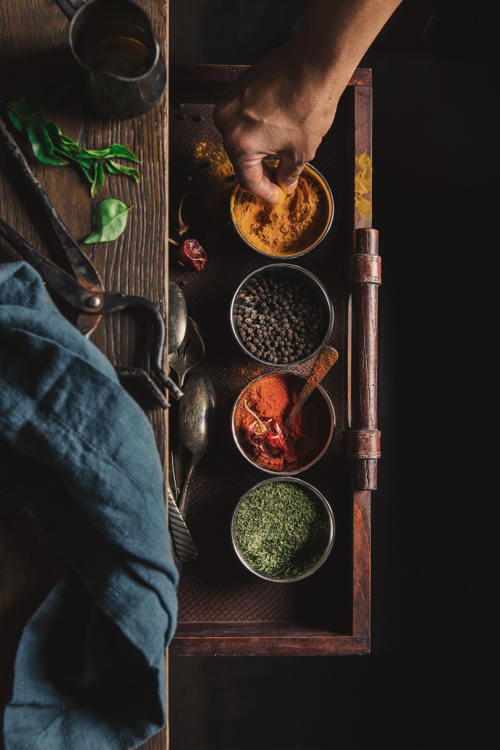 A selection of aromatic spices and ingredients arranged together, reflecting the flavors of Malaysian cooking.