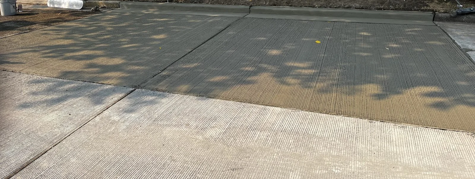 Freshly placed concrete street panels before final turnover
