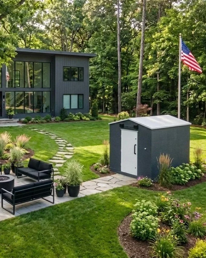 above ground storm shelter in the yard of a modern gray home