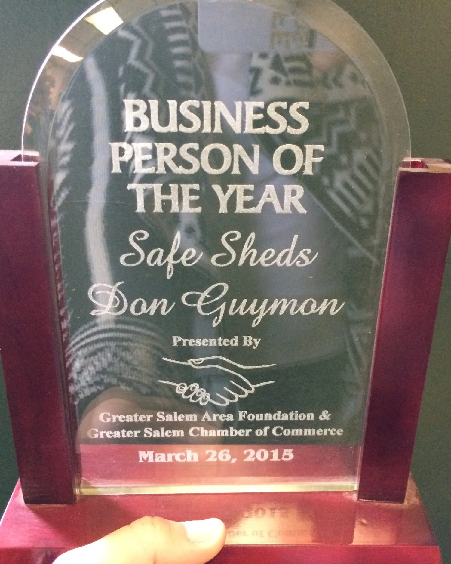 An award plaque recognizing Don Guymon as Business Person of the Year, presented by the Greater Salem Area Foundation and Greater Salem Chamber of Commerce, dated March 26, 2015.