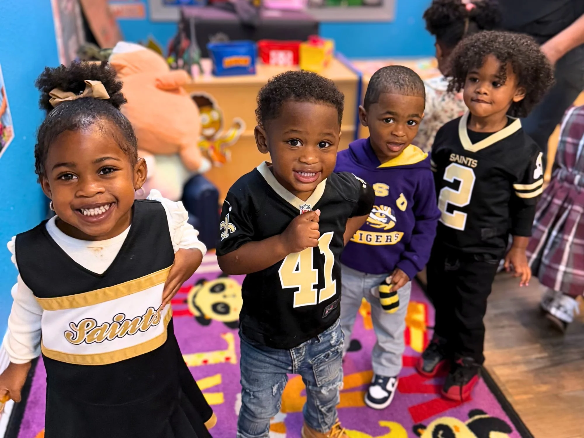 Toddler’s University students dressed in New Orleans Saints gear and merchandise for a school spirit day.