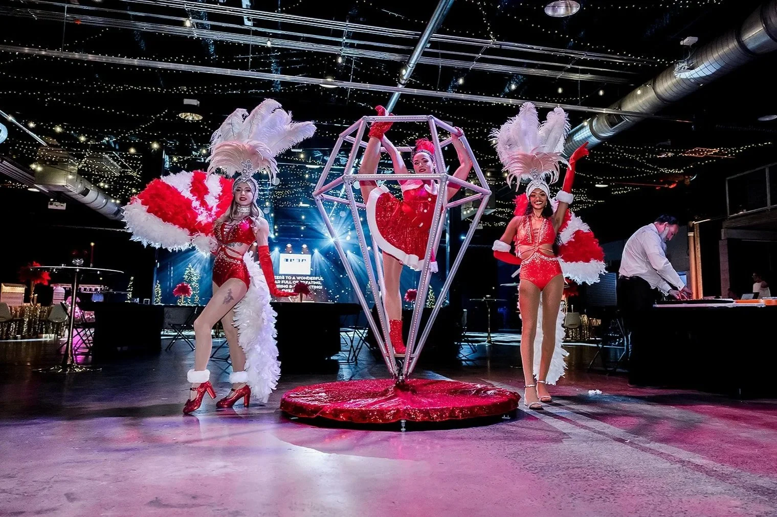 Three casino showgirls in red sequin outfits