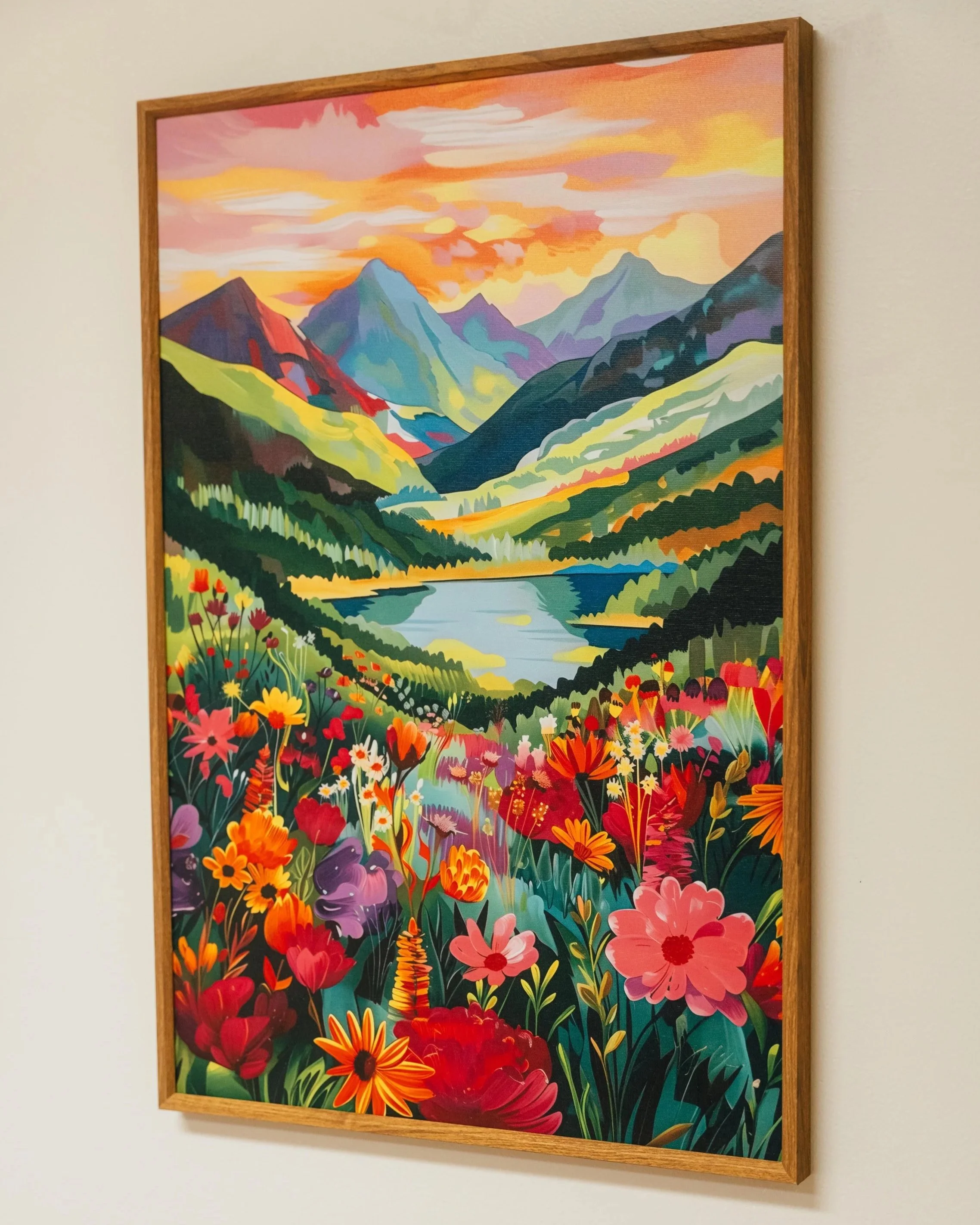 Colorful painting of a mountain landscape with a sunset sky, green hills, a river, and various flowers in the foreground.