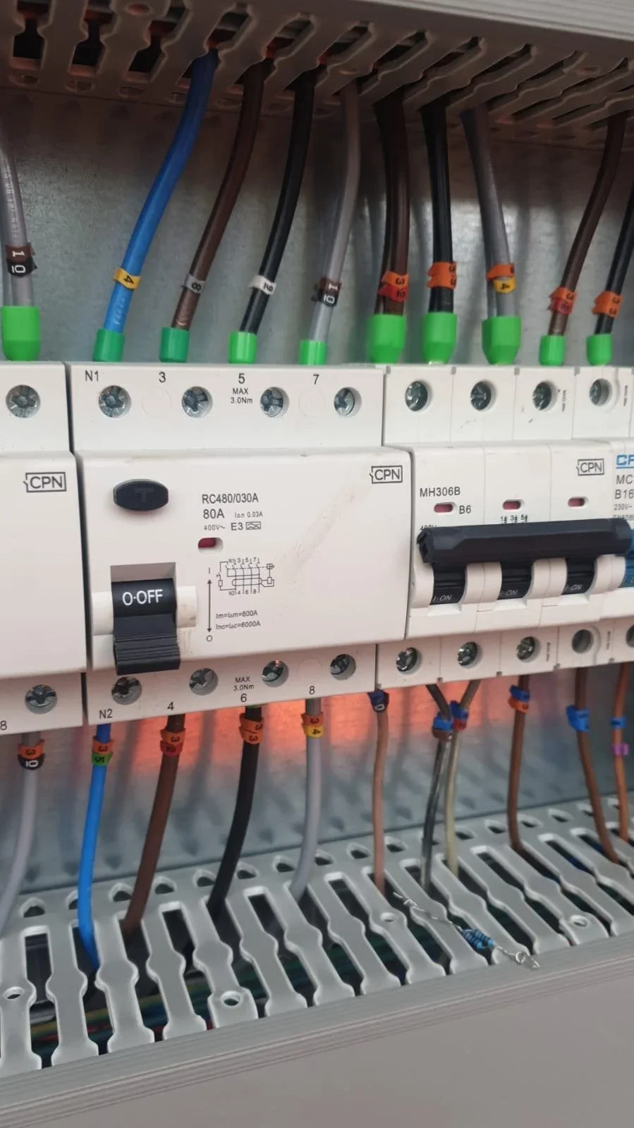 Electrical circuit breaker panel with colour-coded wiring