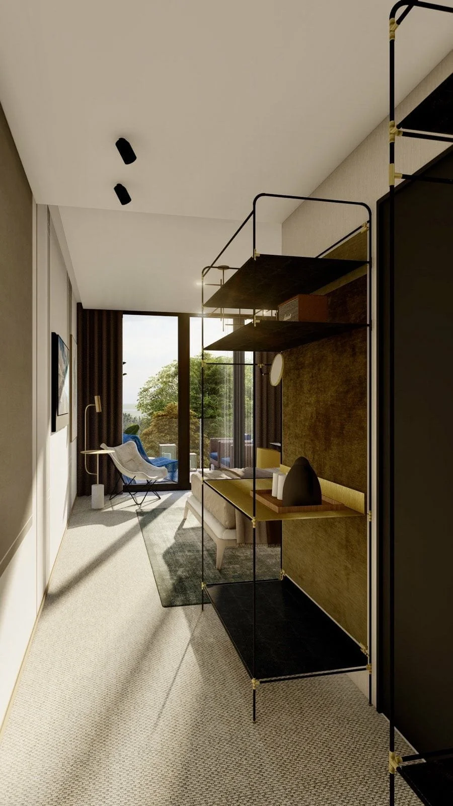Modern living room with beige carpet, black shelving unit, gray sofa, and large glass door leading to outdoor balcony with view of trees.