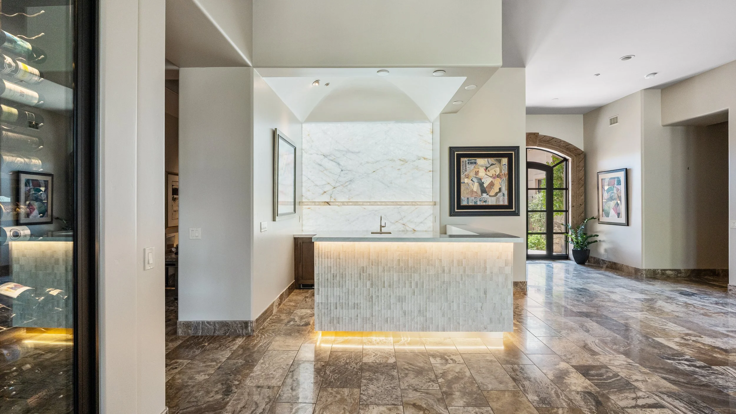 Home bar refresh with modern finishes and backlit natural stone