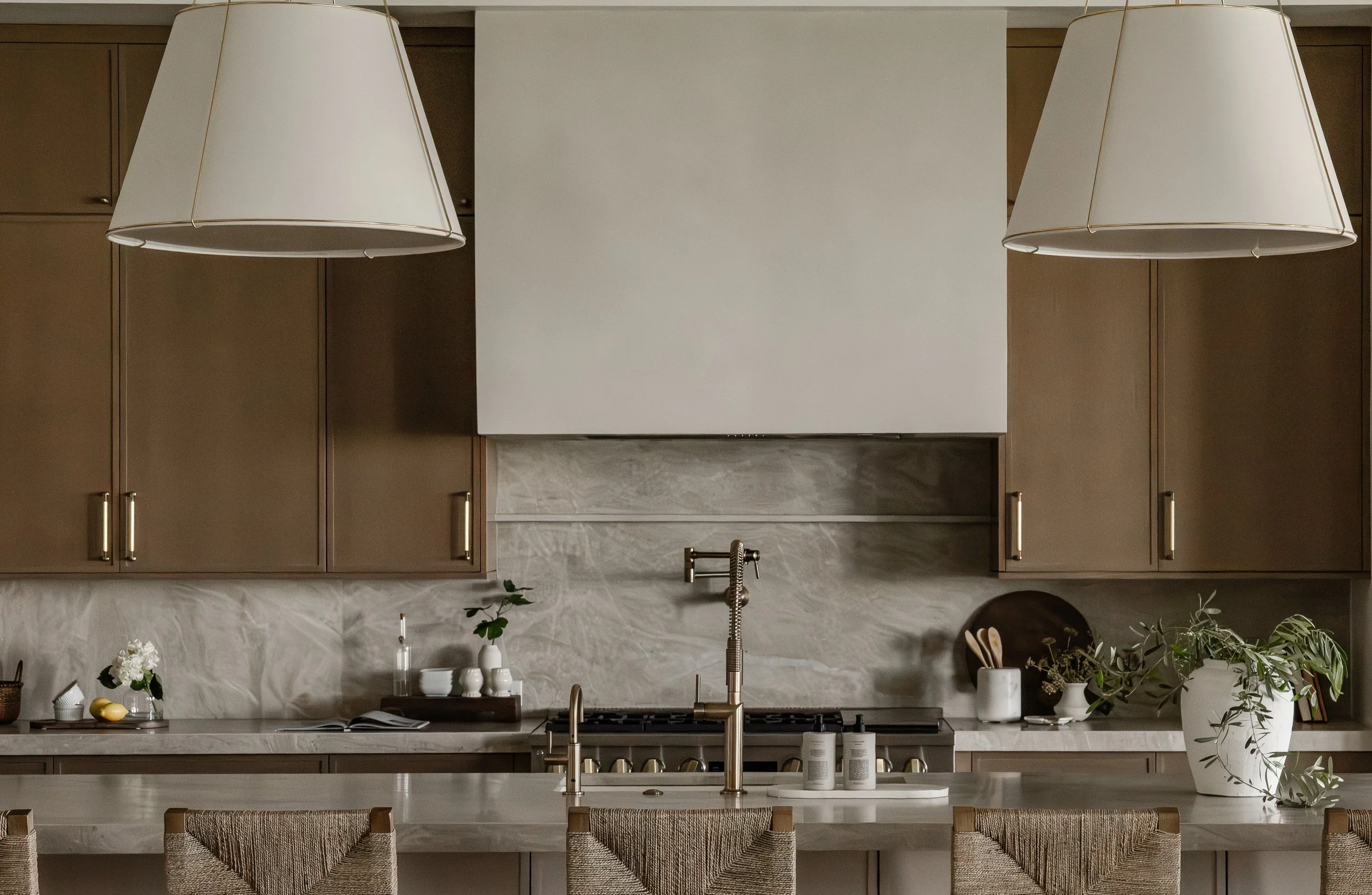 james bond build custom kitchen with white oak cabinets and taj mahal natural stone countertops