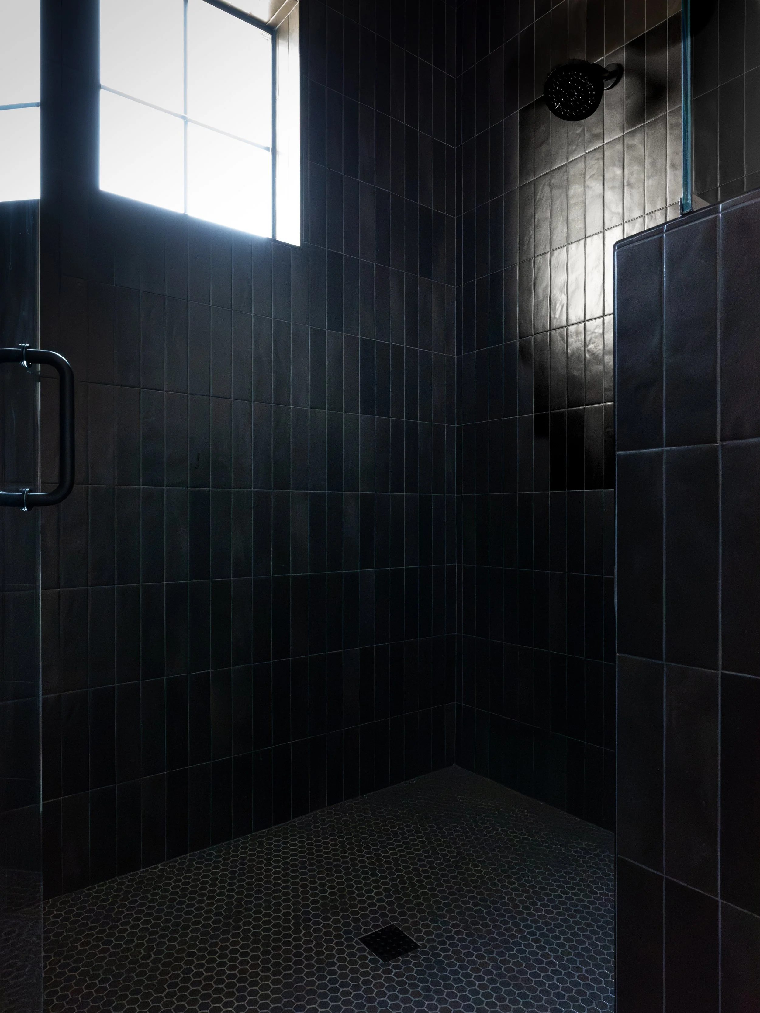 moody bathroom from our james bond custom home project