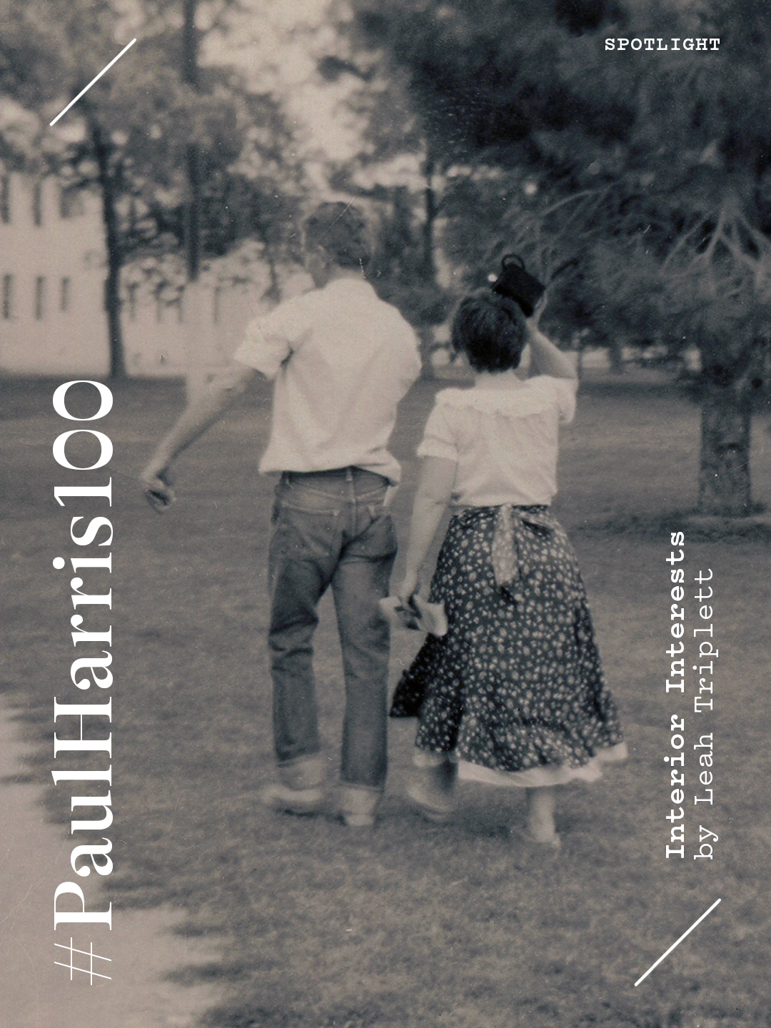 A black-and-white photo of a boy and girl walking together outdoors in a park or field. The girl is holding a hat and both are dressed casually. The background shows trees and a building.
