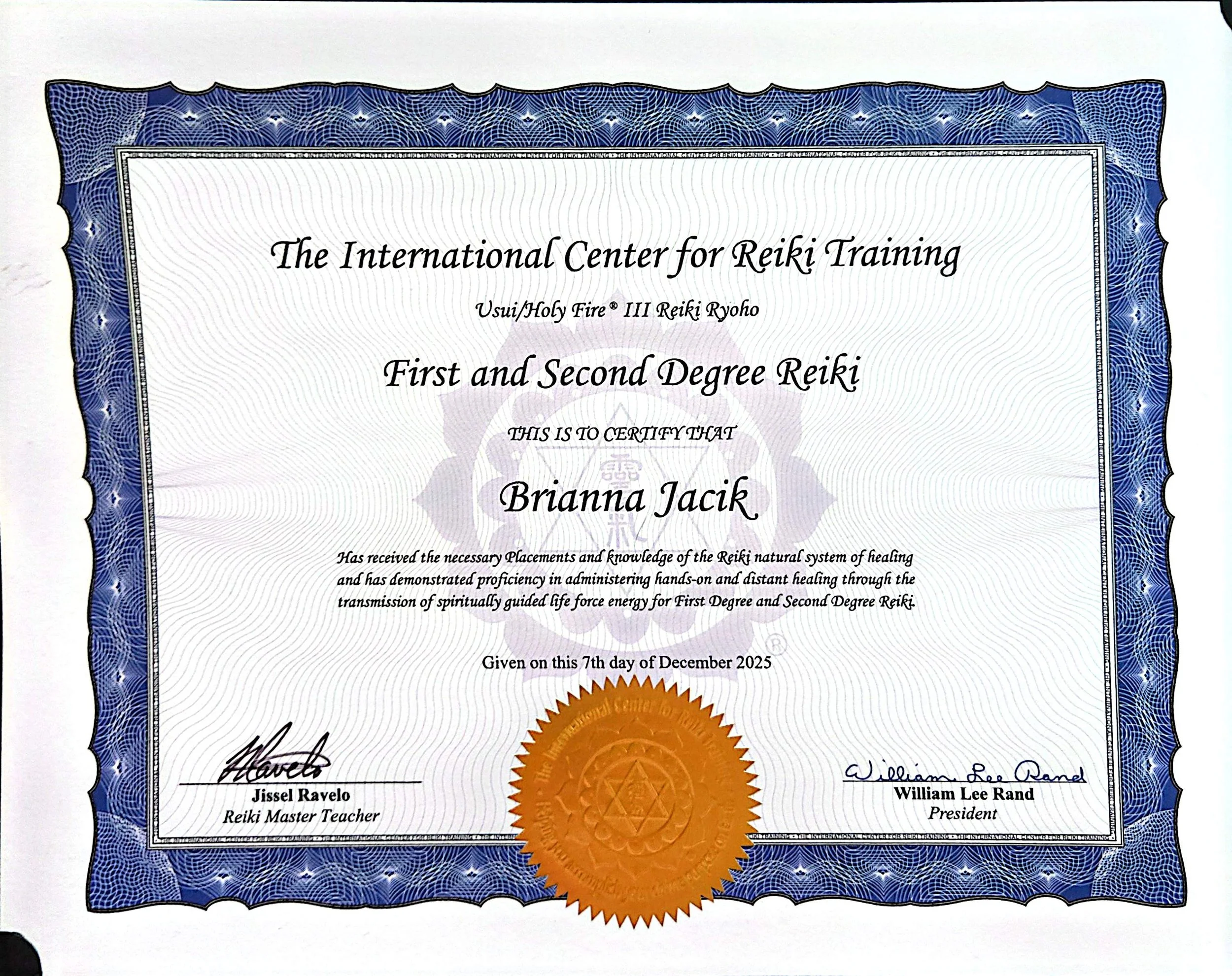 Certificate of Reiki training awarded to Brianna Jacik, signed by Jissel Ravelo and William Lee Rand. The certificate features a blue ornate border, a golden seal, and text describing the achievement.