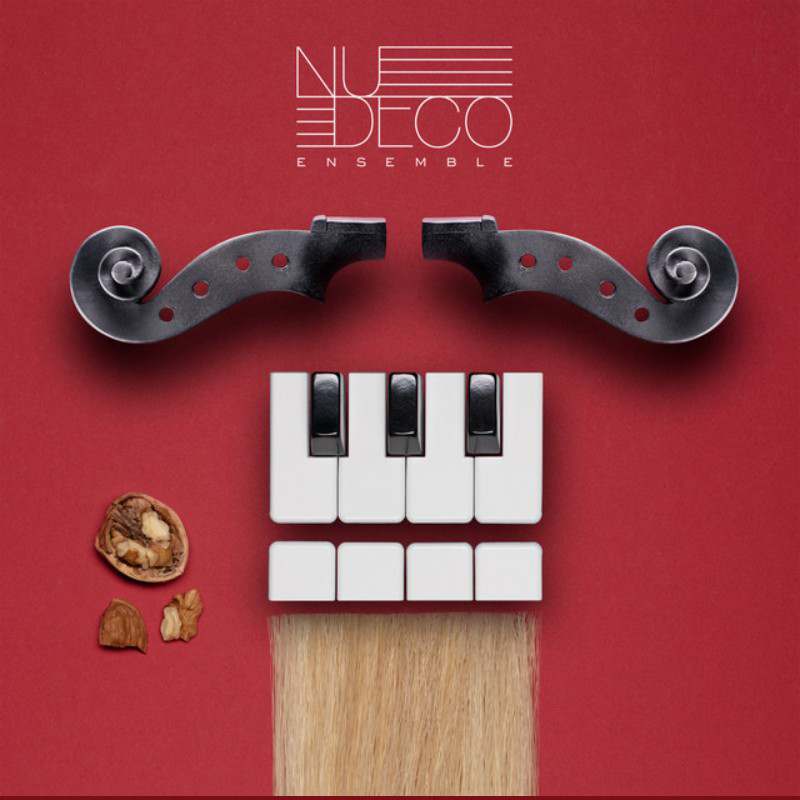 Album cover for Nue Deco Ensemble featuring a stylized hairdryer with a keyboard, musical notes, and a walnut on a red background.