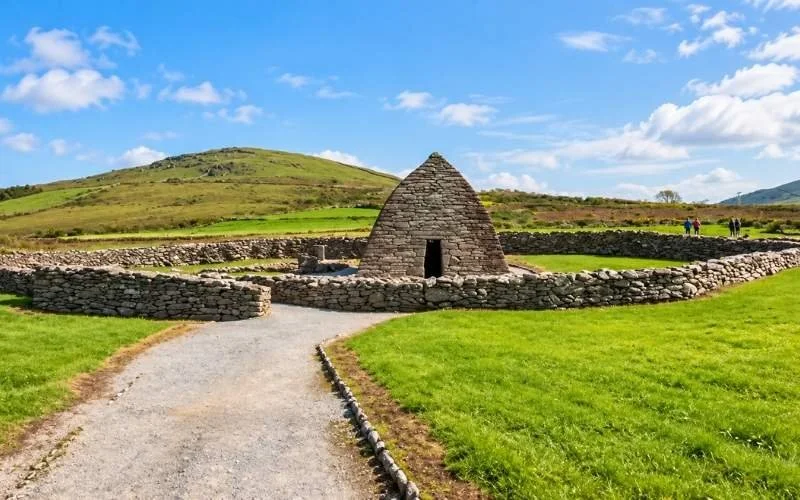 Gallarus Oratory on the Dingle Peninsula offers a glimpse of Kerry’s early Christian heritage, with its distinctive stone shape and peaceful rural setting.