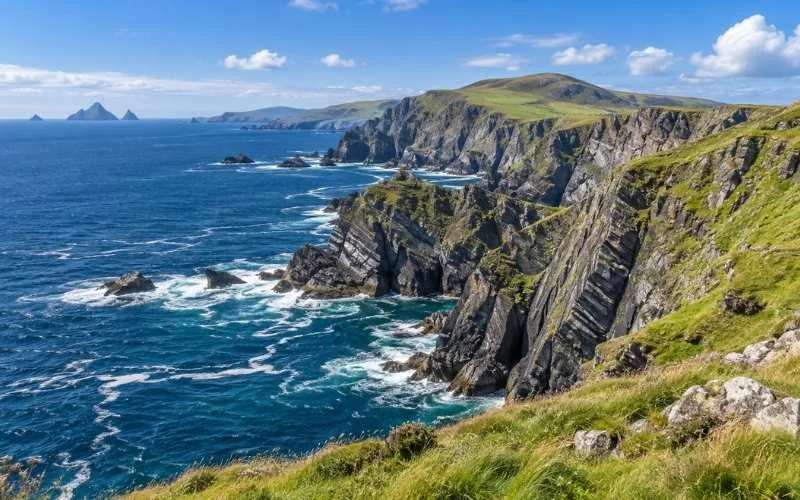 The Kerry Cliffs near Portmagee rise above the Atlantic, offering dramatic coastal views towards offshore islands, with the Skelligs visible on a clear day.