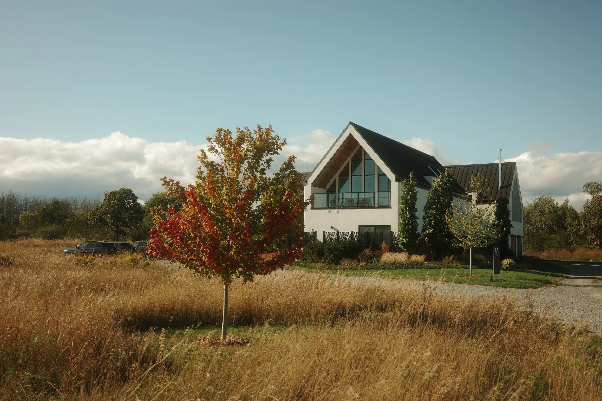 Modern luxury retreat home in Ontario set against rich fall colors for private wedding getaways.