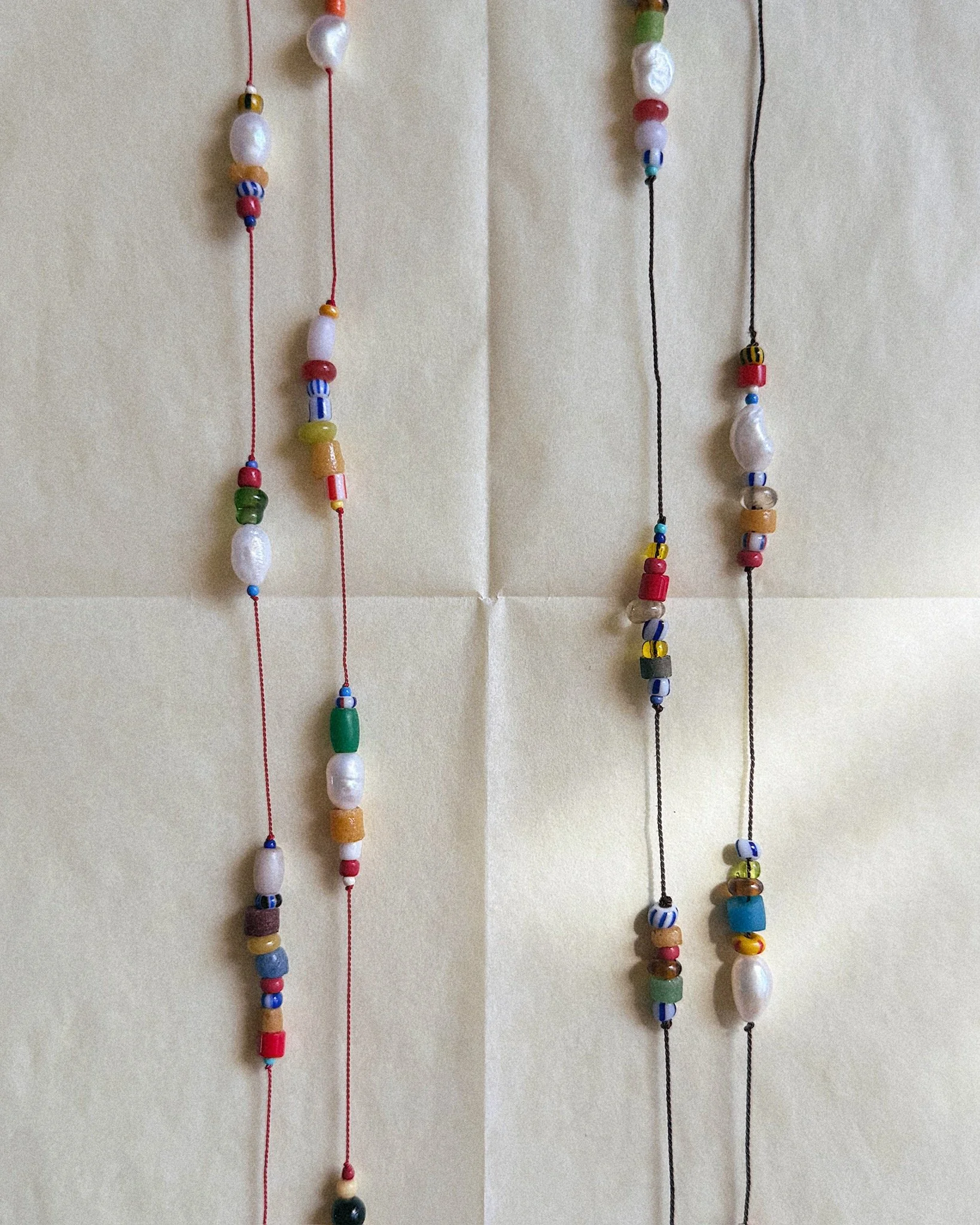 Colorful beads on silk shot from above