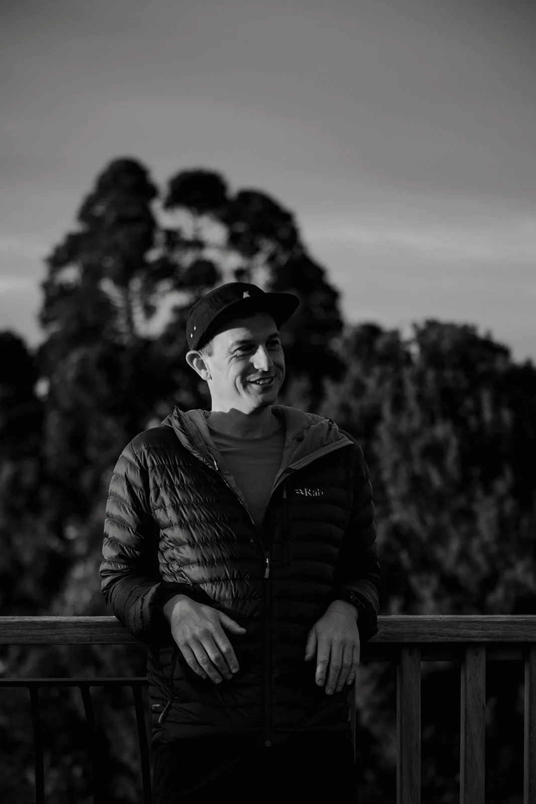Guide and owner of takahe adventures standing in front of native kauri rainforest