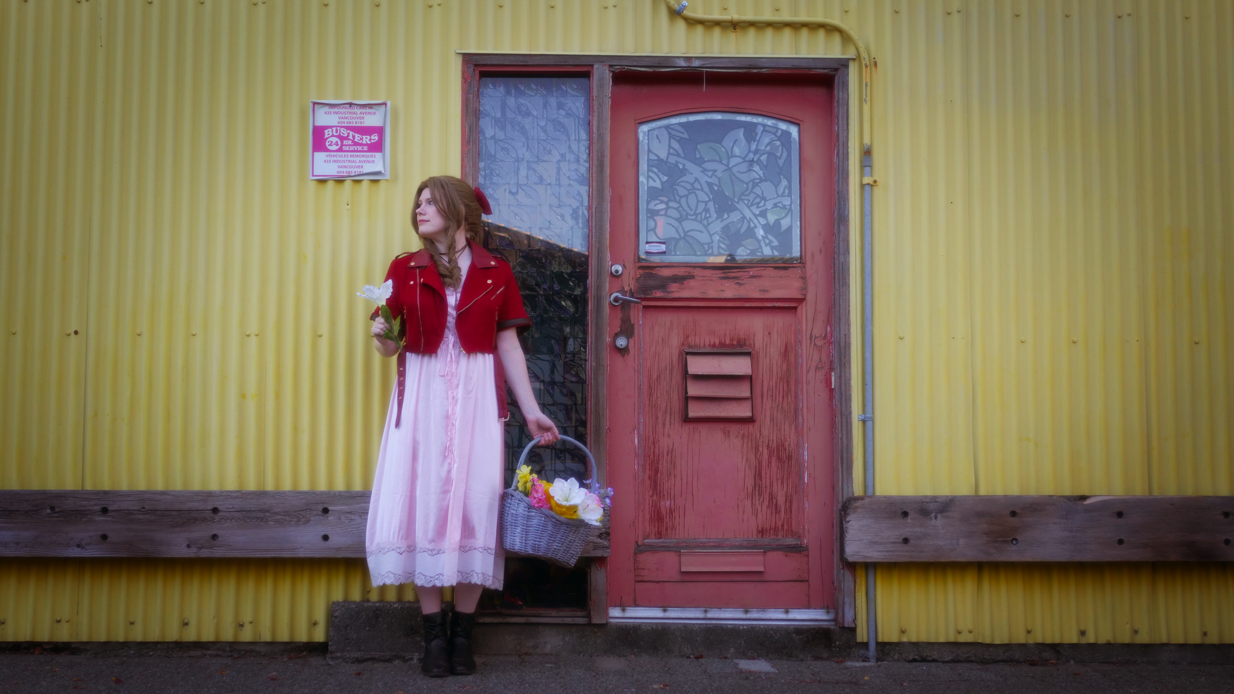 Amelia cosplays Aerith from Final Fantasy 7 at a colourful doorway.