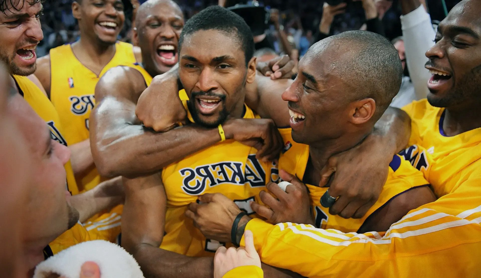 Metta World Peace and Kobe Bryant celebrating a Lakers win.