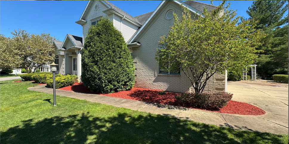 Home in Granger landscaped by Traditions Tree Care