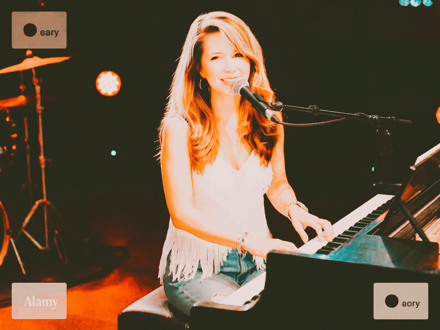 Lori Ann singing and playing piano.