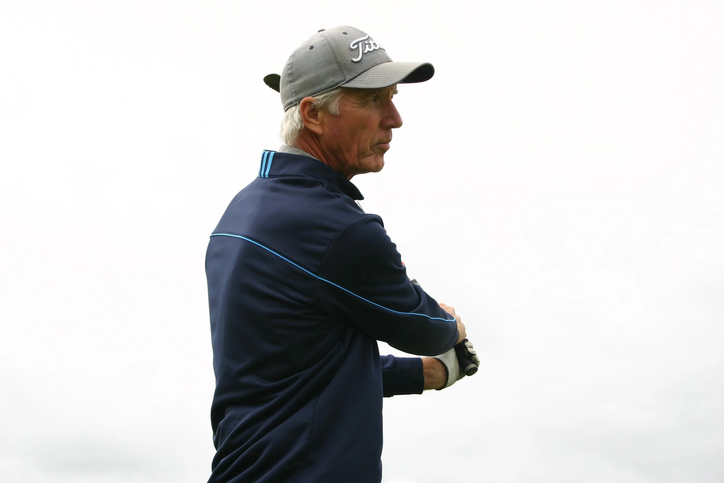 Profile of PGA Master Professional Dave Cahill holding a golf club, against a plain white background.