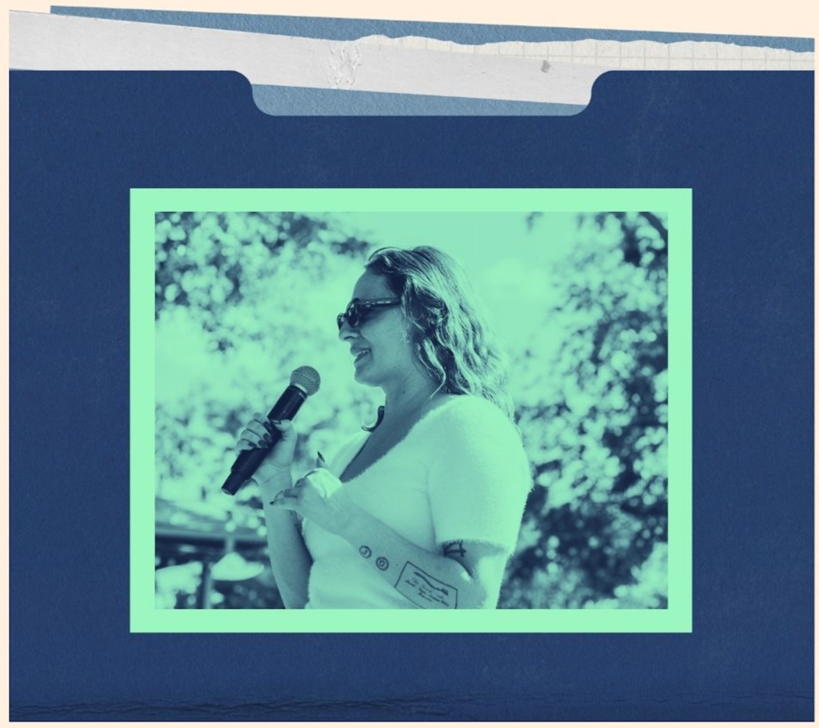 Blue folder with image of person holding microphone up to face to speak