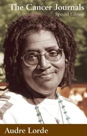 Cover of The Cancer Journals Special Edition by Audre Lorde, featuring a woman with glasses and natural hair outdoors.