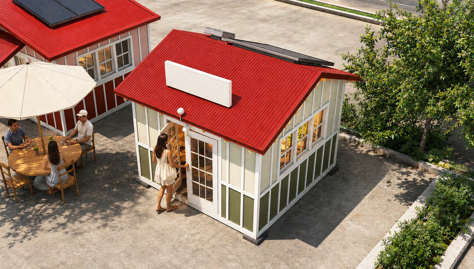 Green storefront at ʻUlu o Lele, with a red roof and outdoor seating.