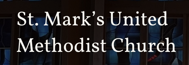 Sign for St. Mark's United Methodist Church with stained glass windows in the background.