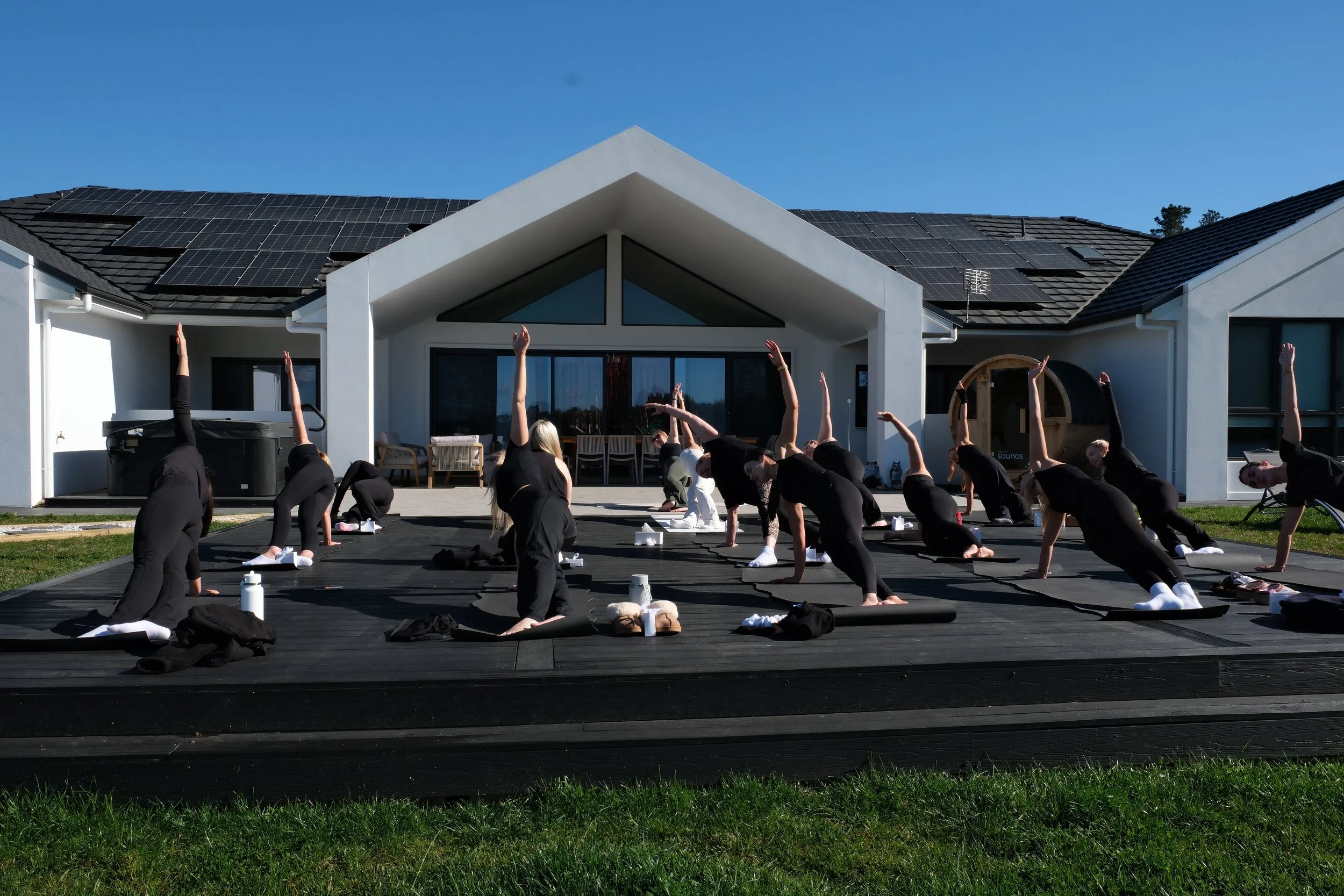 Hens party guests enjoying an outdoor Mat Pilates class in Burradoo, Southern Highlands.