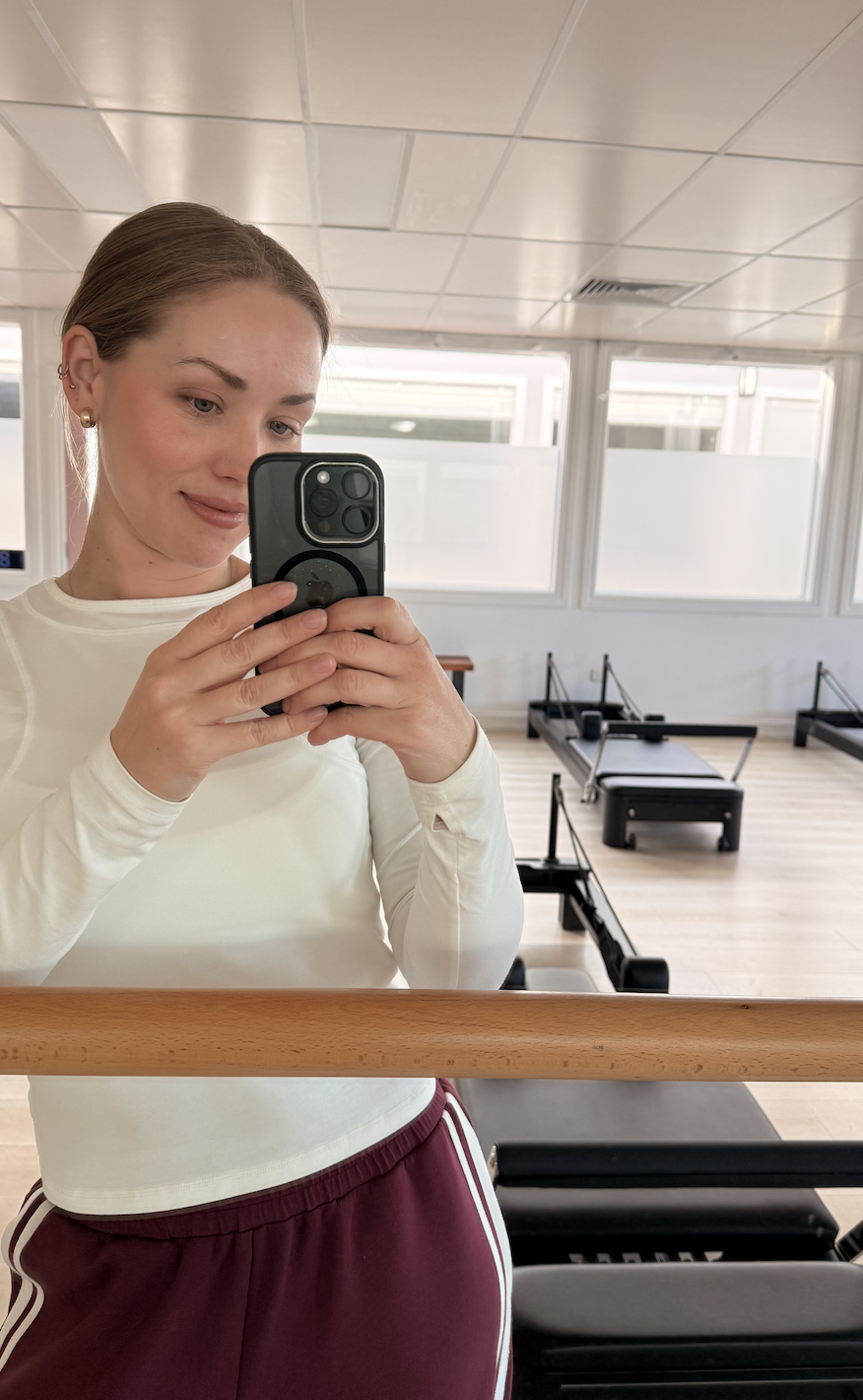 Pilates instructor Brooke in a Reformer Pilates studio in the Southern Highlands.