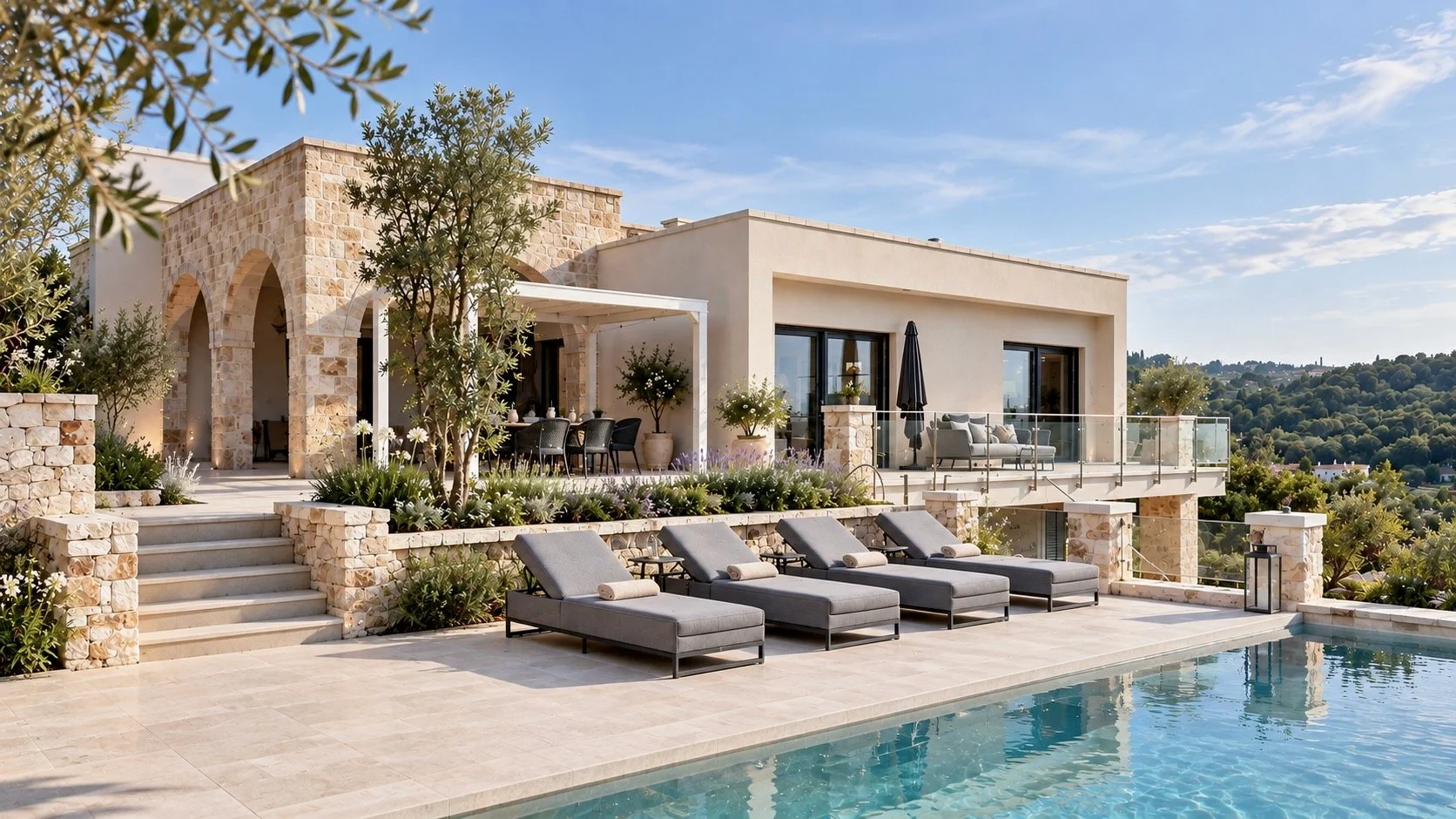 Luxury house with a swimming pool, outdoor lounge chairs, and a patio area with dining furniture, surrounded by greenery and overlooking hills under a partly cloudy sky.
