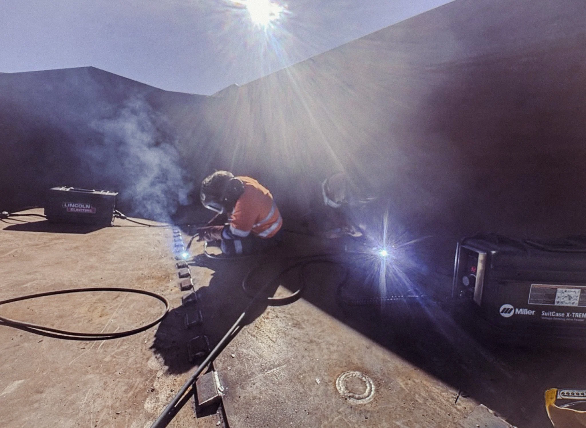 CWS boilermaker carrying out on-site welding repairs on mining equipment with CWS tooling