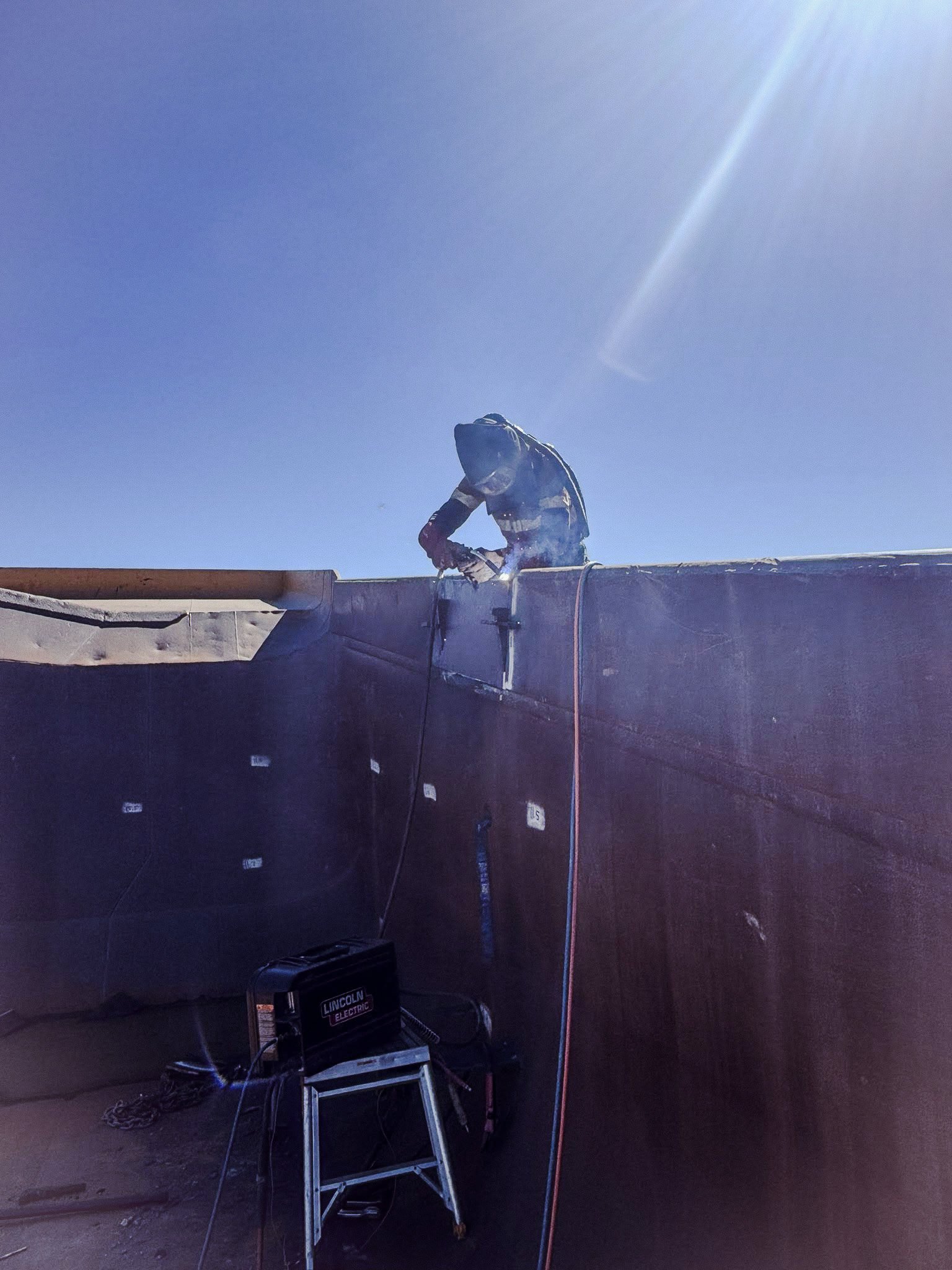 CWS Heavy Maintenance Repairs boilermaker welding a repair on a mining haul-truck tray on-site in the Bowen Basin