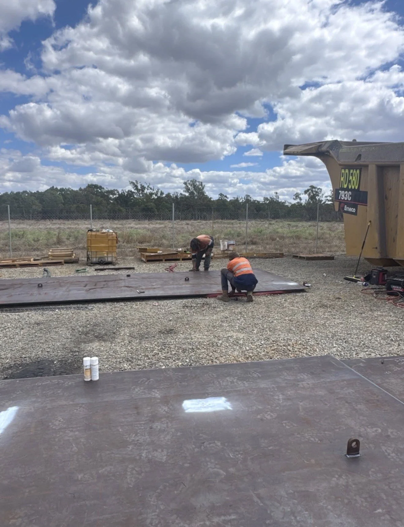CWS Heavy Maintenance Repairs tradespeople carrying out on-site fabrication beside a haul truck at a Bowen Basin mine