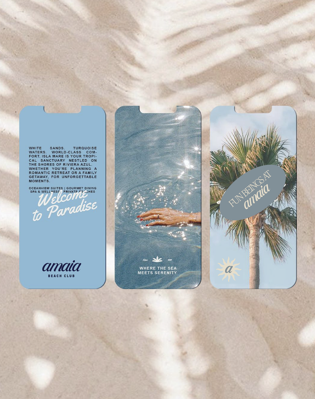 Three promotional cards for Amaia Beach Club laid on sandy beach with shadows of leaves in the background. The first card has a blue background with text about the beach club; the second shows a hand in water with the caption "Where the sea meets serenity"; the third features a palm tree with a label "Fun being at Amaia".