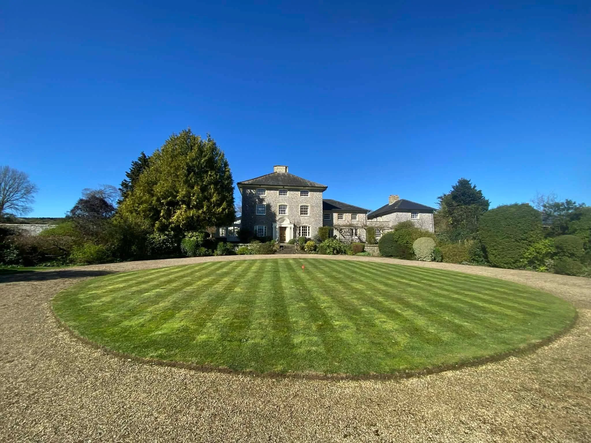 A finish we're proud of &mdash; this lawn was cut, edged, and striped to bring the whole approach together. Small details like this are what "handled properly" means to us.

#GardenMaintenanceMidhurst #WestSussexGardens #LawnCare #TheItList