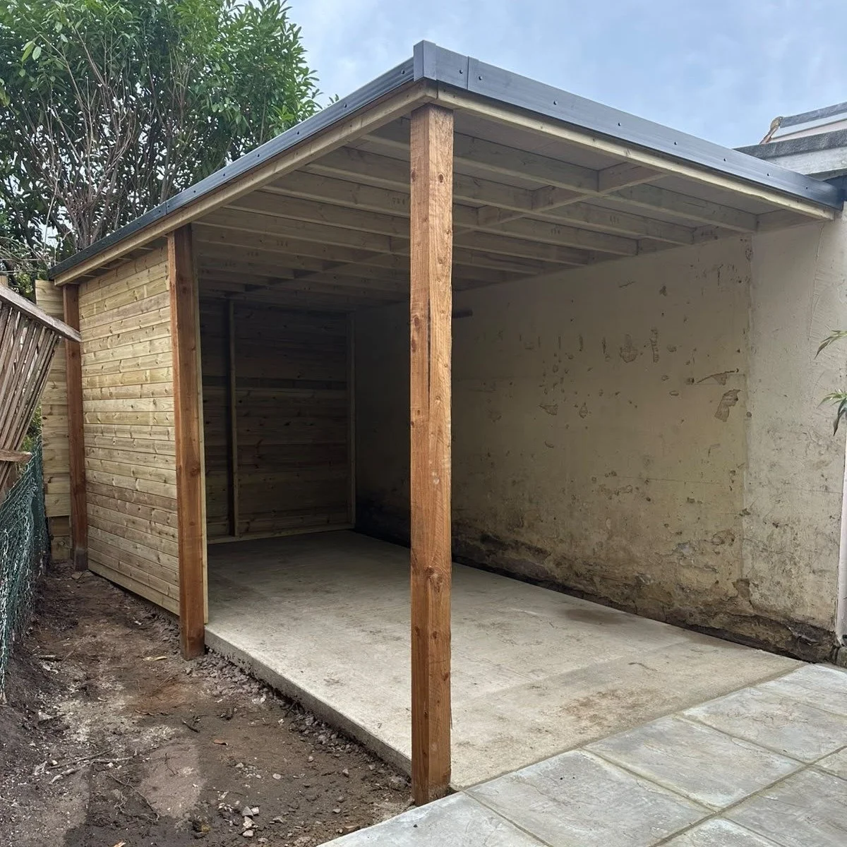 From cleared ground to finished structure &mdash; this lean-to went from an overgrown, cluttered corner to a proper built space: concrete base, timber frame, roof on, new slabs laid. Every stage matters; it's satisfying to see it all come together.

