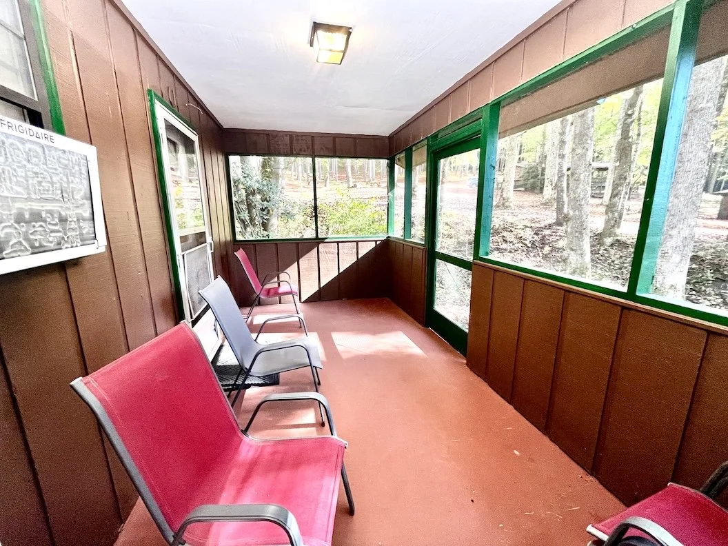 Back porch. You can hear and see the creek from this lovely porch.