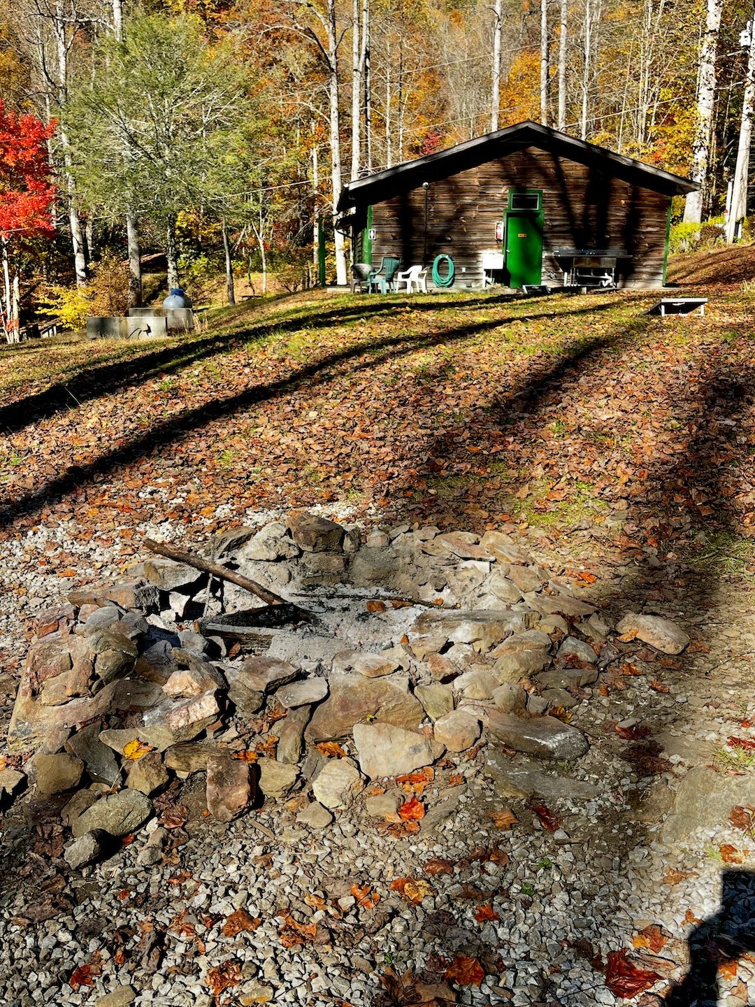 Communal fire pit and bathhouse in background