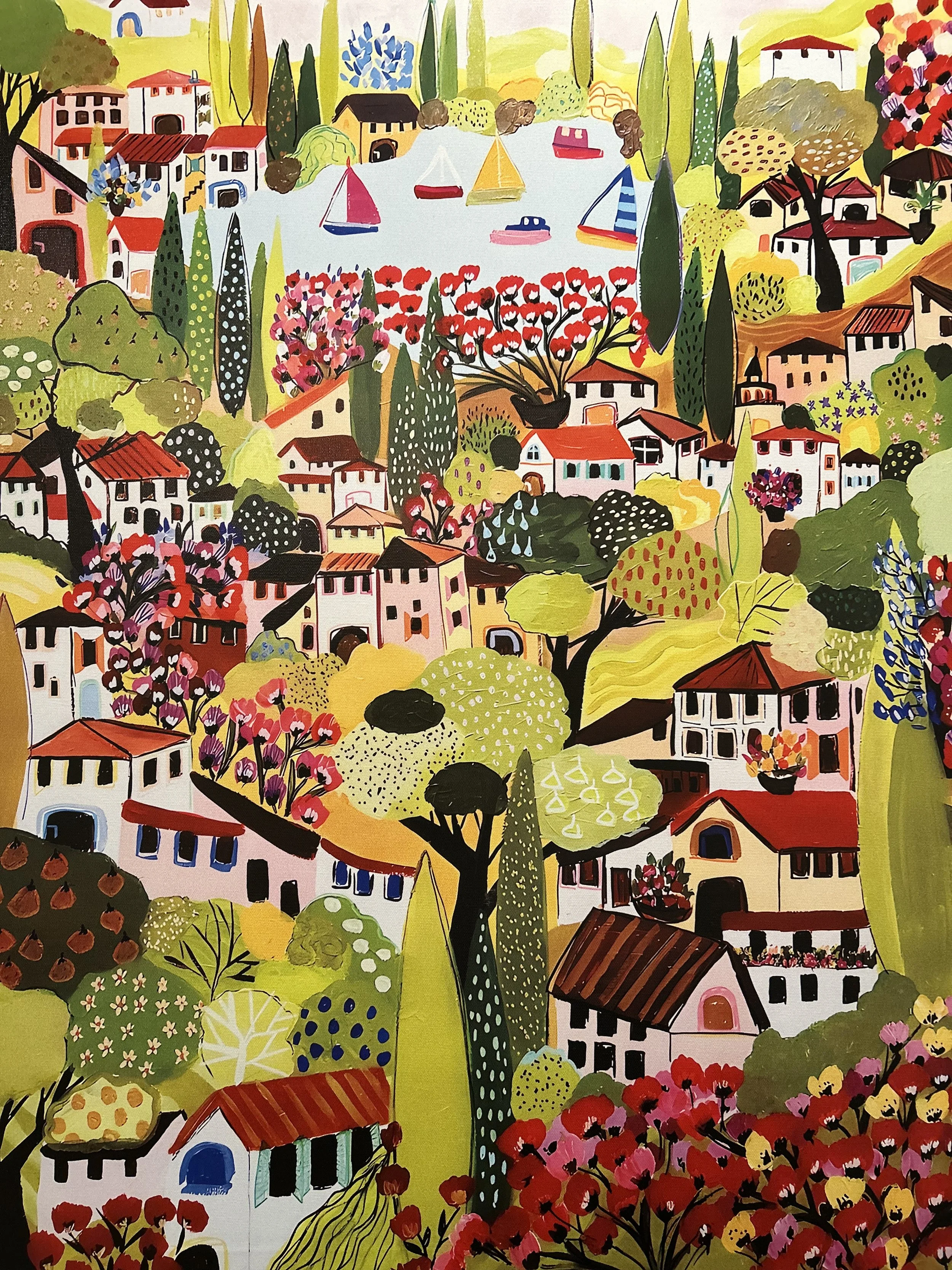Colorful landscape painting of a village with houses, trees, and a lake with sailboats.