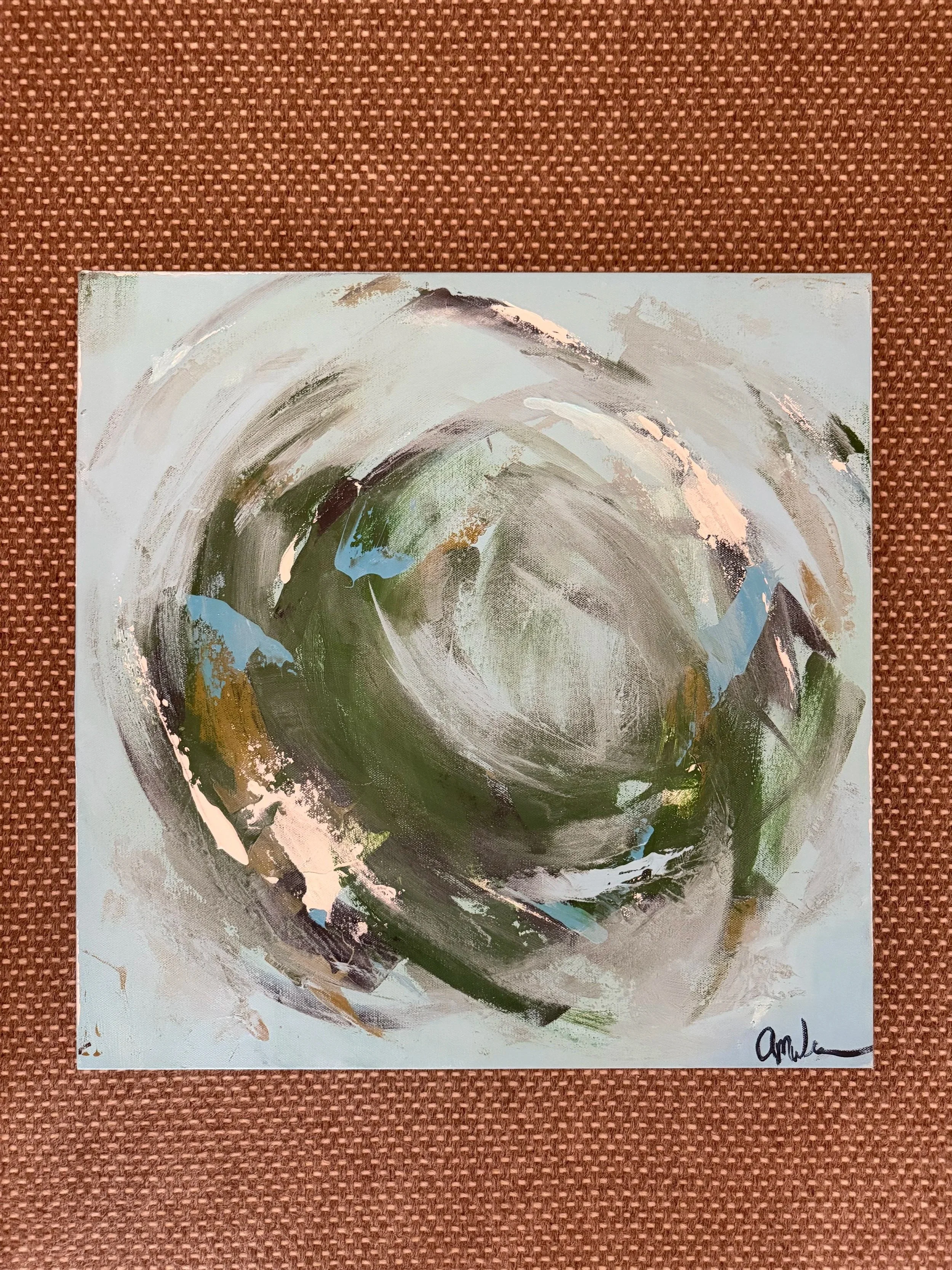 An abstract painting featuring swirling brushstrokes in shades of green, brown, white, and blue on a light background, signed in the bottom right corner.