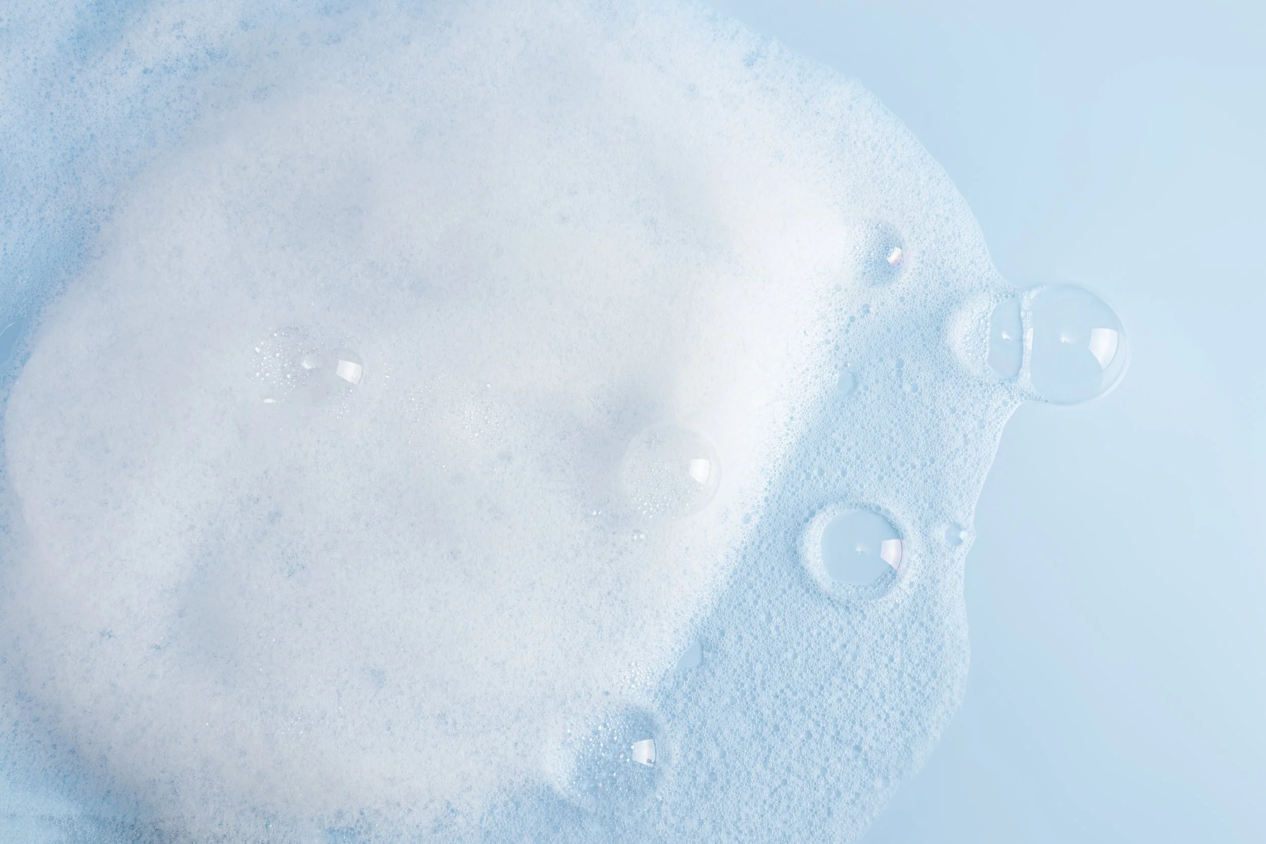 airy-bubbles-and-foaming-suds-on-blue-surface-2026-03-25-05-48-10-utc.jpg