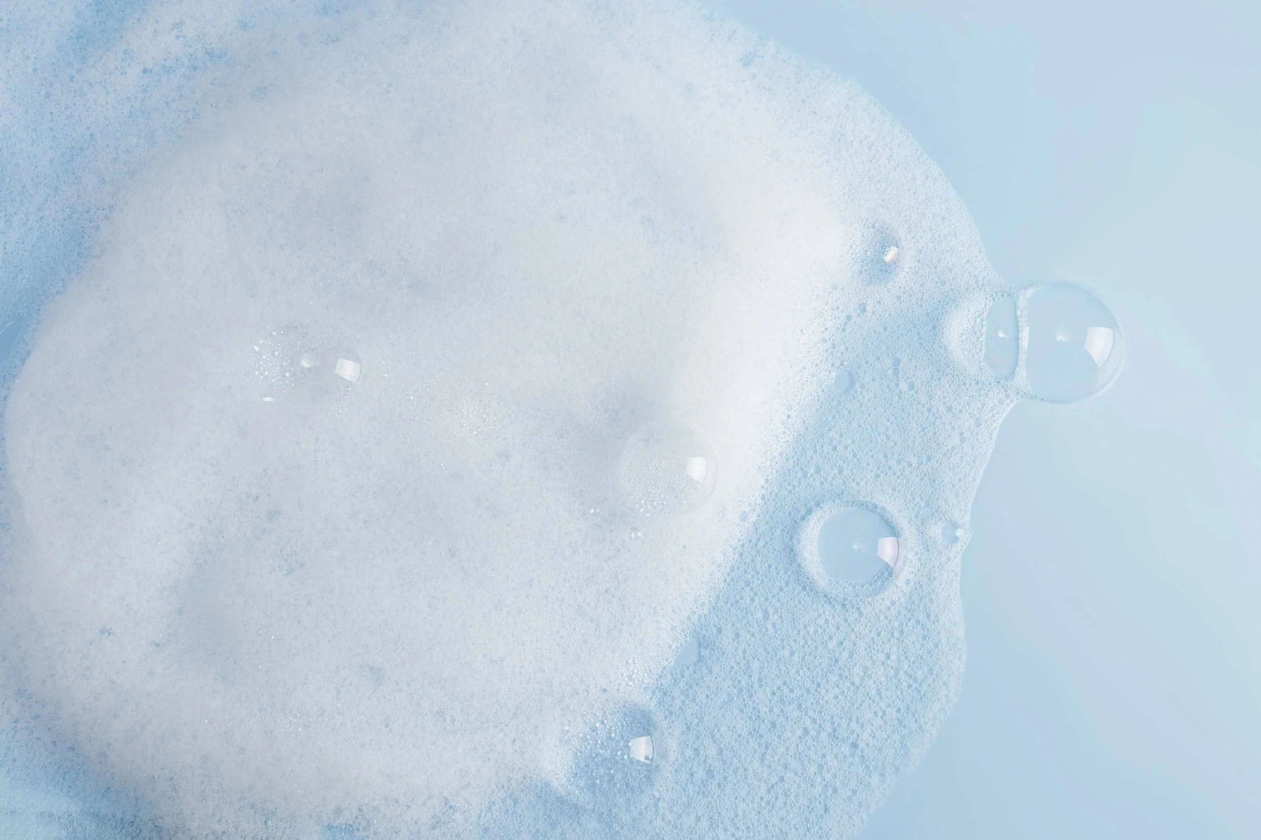 airy-bubbles-and-foaming-suds-on-blue-surface-2026-03-25-05-48-10-utc.jpg