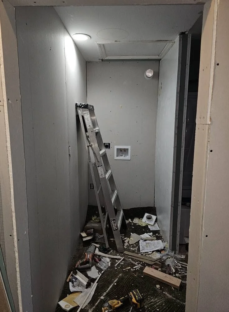Drywall in the new bathroom area during the build