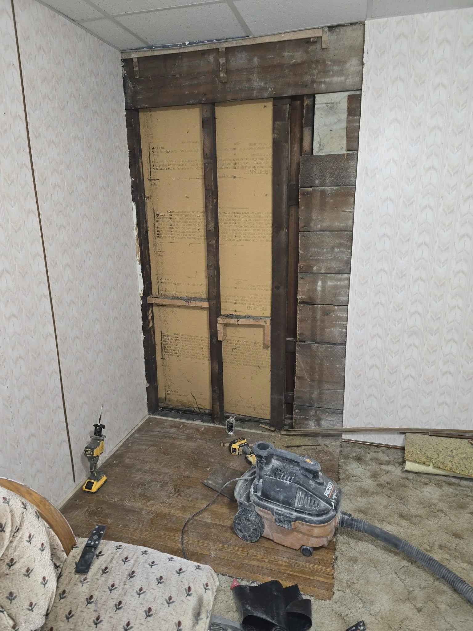 The opened wall and doorway area cleaned up after demolition