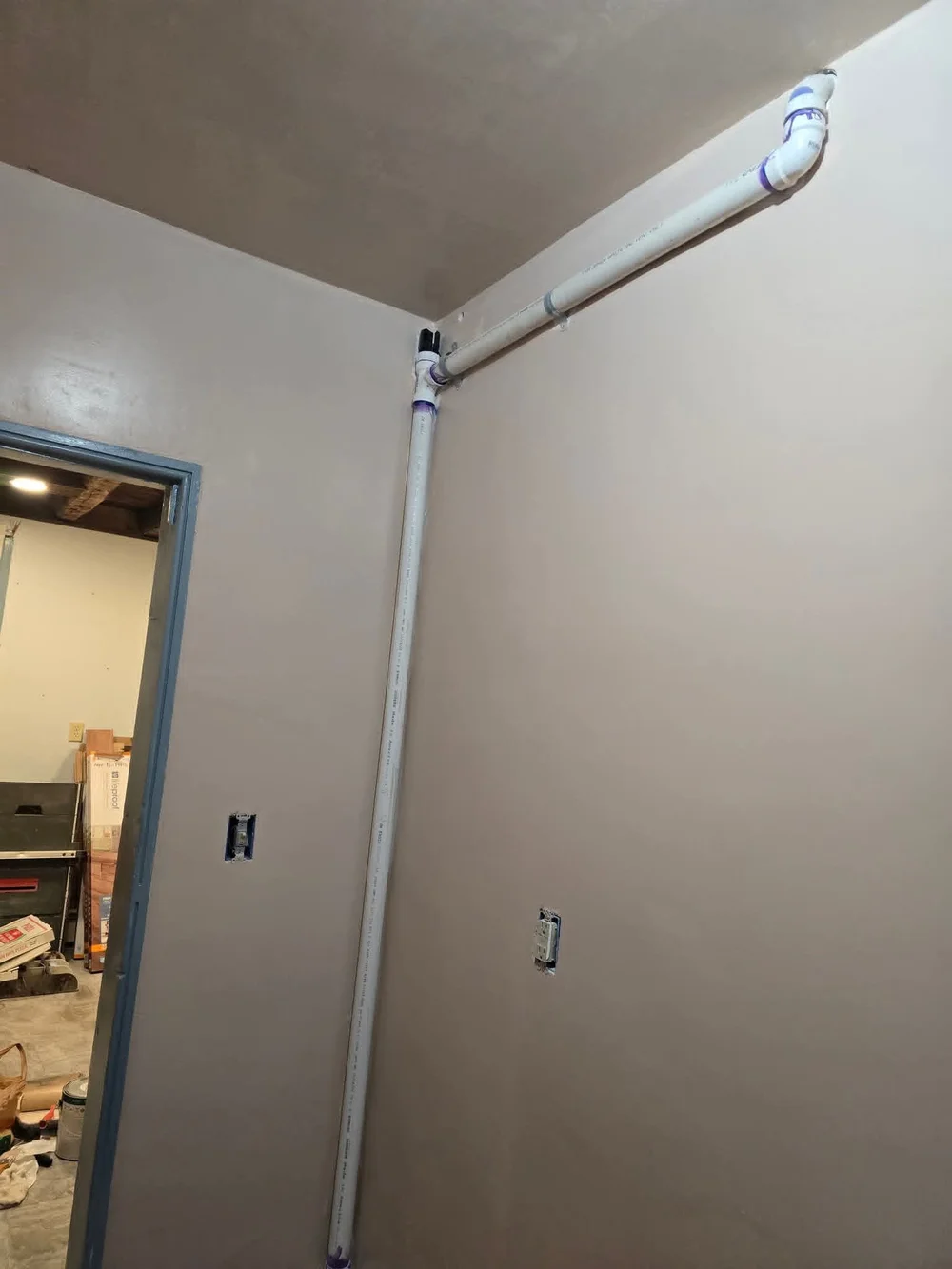 The visible pipe run during the plumbing work.