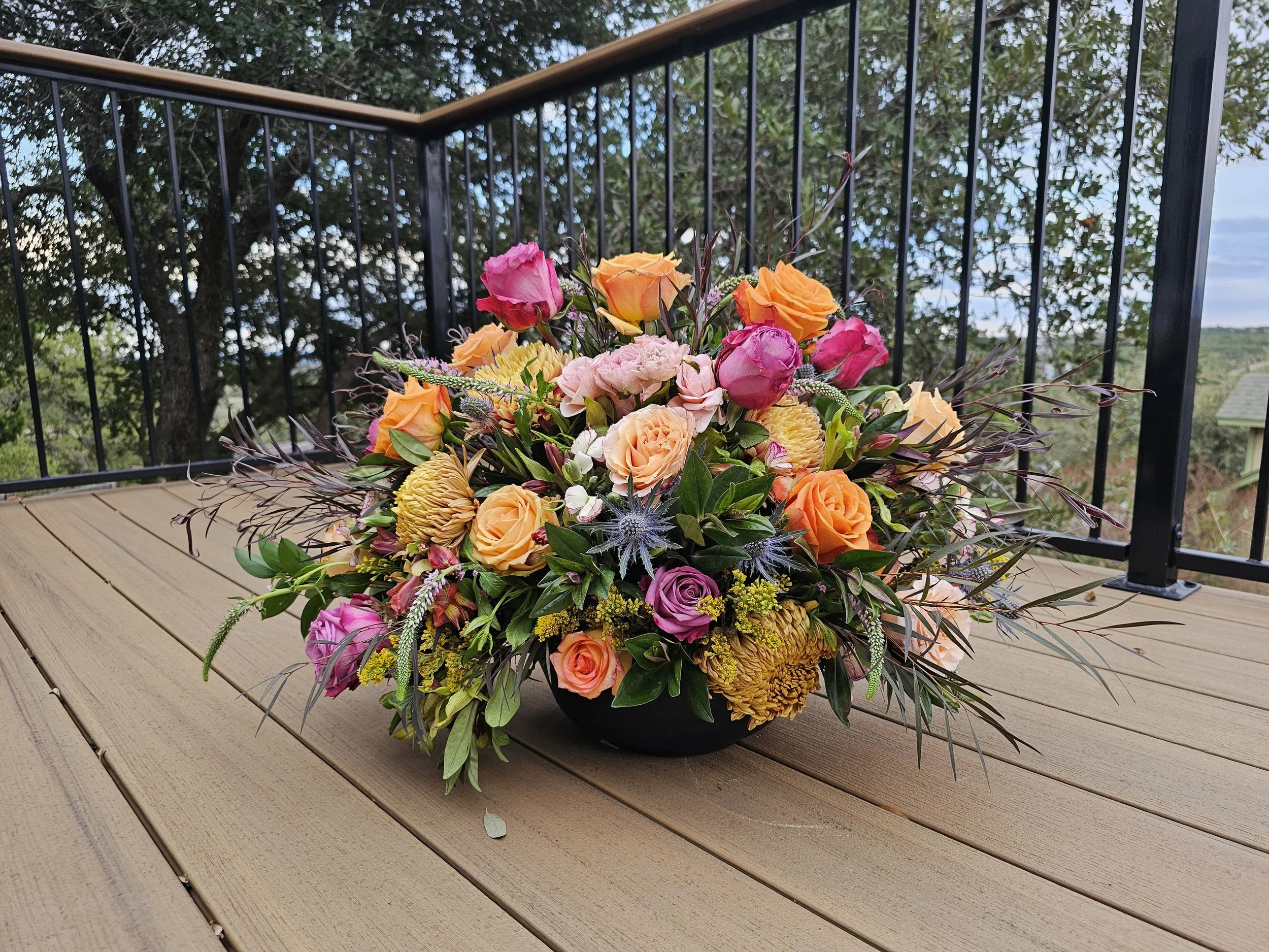 Colorful flower bouquet with pink, orange, yellow, and purple flowers